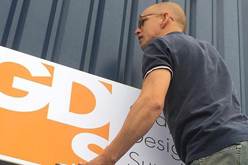 GDS outdoor banner being fitted